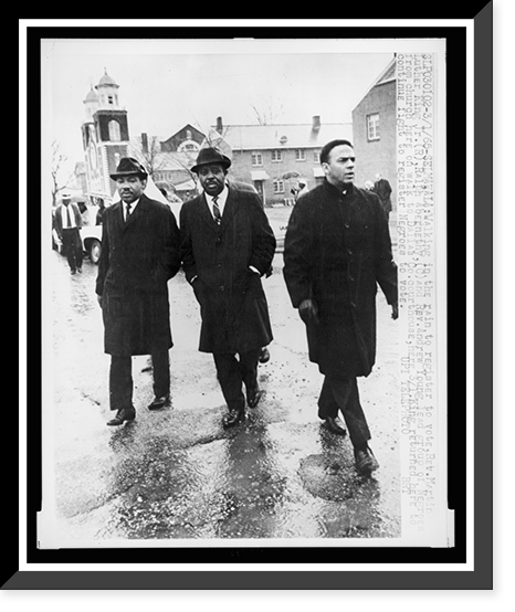 Historic Framed Print, Walking in the rain to register to vote, Rev. Martin Luther King, Jr., right, Ralph Abernethy [sic], center, and Rev. Andrew Young lead group of Negroes from church here on walk to Dallas Co. courthouse,  17-7/8" x 21-7/8"