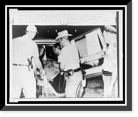 Historic Framed Print, Authorities remove one of three bodies from an ambulance at the University Medical Center,  17-7/8" x 21-7/8"