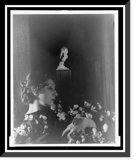 Historic Framed Print, [Judith Anderson, half-length portrait, reclining, clutching flowers, facing right],  17-7/8" x 21-7/8"
