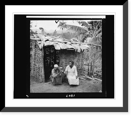 Historic Framed Print, [Two portraits of women seated in front of hut, shaking rattles, taken during visit by Alan Lomax and Mary Elizabeth Barnicle to Andros Island in the Bahamas],  17-7/8" x 21-7/8"