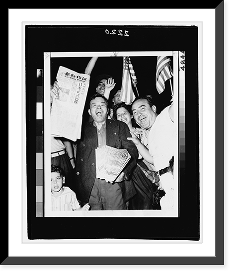 Historic Framed Print, [Chinese newspaper vendor, among crowd of people waving American flags in Chinatown, New York City, holds newspaper, The China Tribune, announcing surrender of the Japanese in 1945],  17-7/8" x 21-7/8"