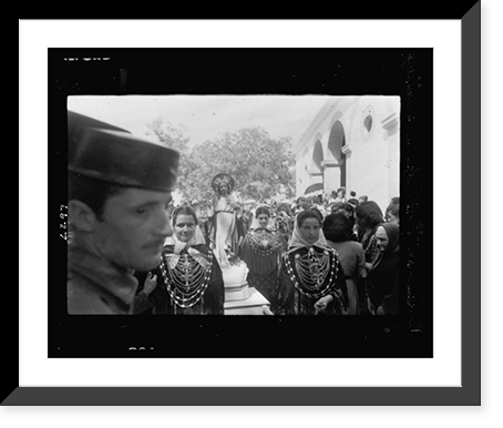 Historic Framed Print, [Four young women, wearing ornate costume, carrying a statue of Jesus Christ in a religious procession in Ibiza],  17-7/8" x 21-7/8"