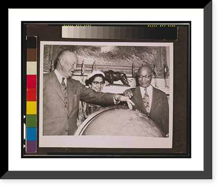 Matthew Henson shows President Eisenhower the location of the North Pole on a globe at the White House while his wife, Lucy Henson, watches - 2, Vintage Print