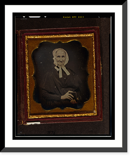 Unidentified woman, head-and-shoulders portrait, facing front, wearing white cap and holding daguerreotype case, Antique Print