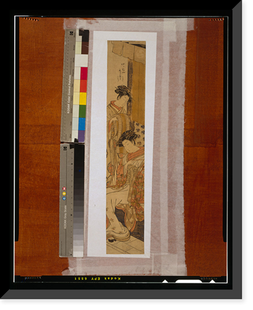 Historic Framed Print, [A woman seated holding a pipe and another woman standing on the left holding a kimono],  17-7/8" x 21-7/8"