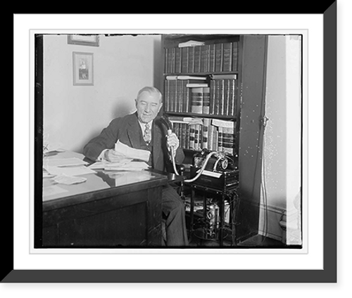 Historic Framed Print, [Unidentified man seated at desk with microphone],  17-7/8" x 21-7/8"