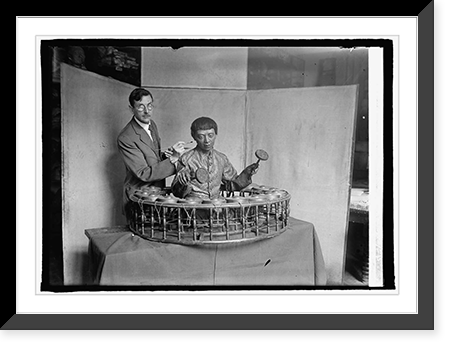 Historic Framed Print, Wm. H. Egberts of Nat'l Museum with Siamese musician, 5/11/25,  17-7/8" x 21-7/8"