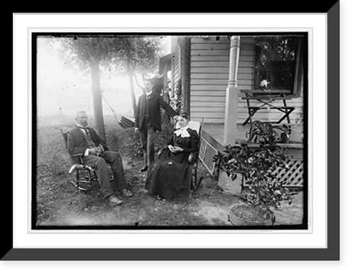 Historic Framed Print, [Unidentified men and woman seated in yard next to house],  17-7/8" x 21-7/8"