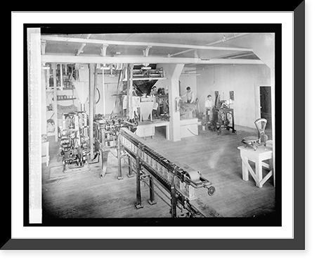 Historic Framed Print, Carton Machine. Also showing filling and sewing 25 lb. sacks in background of picture,  17-7/8" x 21-7/8"