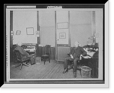 Historic Framed Print, [Henry Leland (right) and Robert Faulconer (left), in office at Leland & Faulconer Manufacturing Co., Detroit, Mich.],  17-7/8" x 21-7/8"