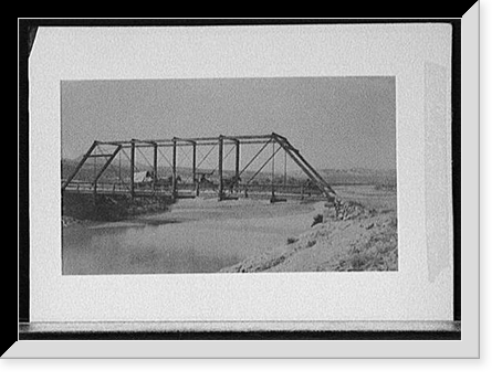 Carriage and wagon crossing bridge over river bluff, Antique Poster