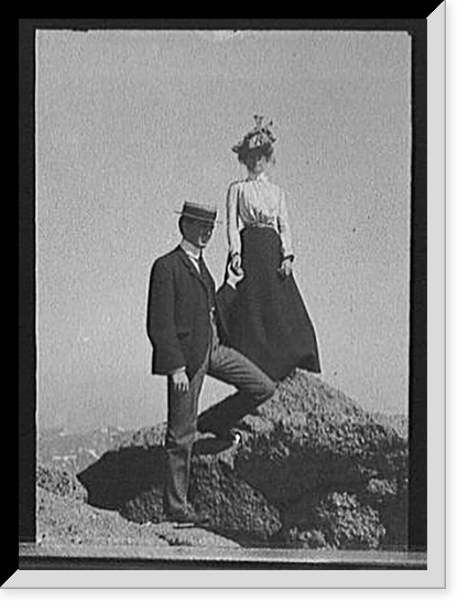 Young couple on rock holding hands, full-lengthportrait, Antique Poster