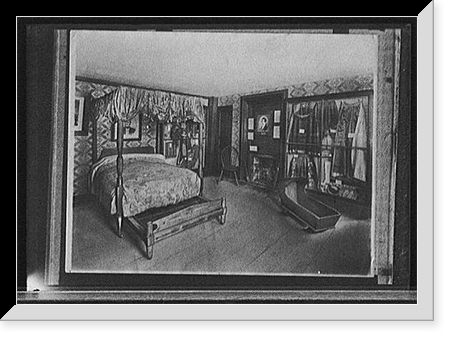 Bedroom with trundle bed, cradle, and costume display, possibly in historic house or museum, Antique Poster