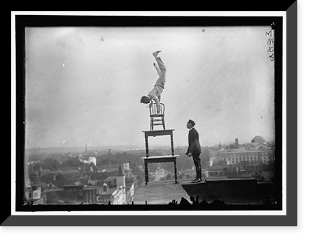 REYNOLDS, J., PERFORMING ACROBATIC AND BALANCING ACTS ON HIGH CORNICE ABOVE 9TH STREET, N.W. - 6, Antique Poster