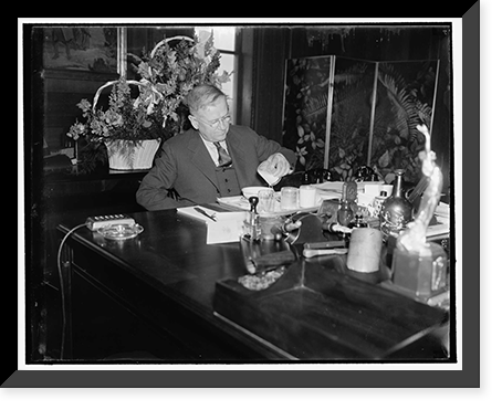 Secretary of Interior enjoys lunch in new office. Washington, D.C., April 6. Classic, Vintage Print
