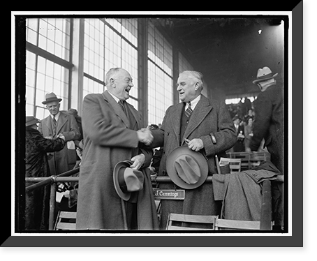 Senator Joseph F. Guffey, of Penna., right with CY Cummings, a member of the Curtis Walker Democratic Club, and well known in Maryland's racing circles, snap as they greated each other at the Bowie