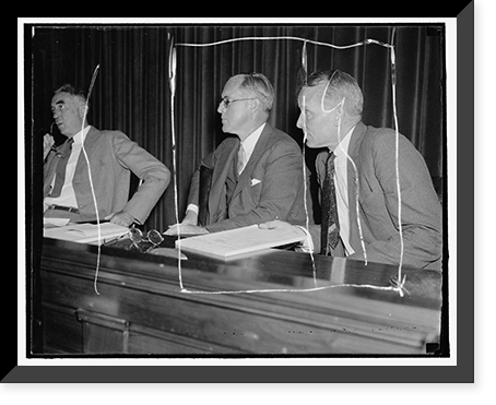 Listen to maritime troubles. Washington, D.C. Aug. 23. Chairman Joseph P. Kennedy, (left) and Commissioner Emory S. Land listen intently as maritime labor chiefs testify at the initial hearing of t