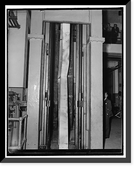 Steel bending. Washington, D.C., Sept. 23. Photo shows the welded steel knees in the 600,000 lb. testing machine at the U.S. Bureau of Standards today, as it buckled under 153,600 lb. maximum load