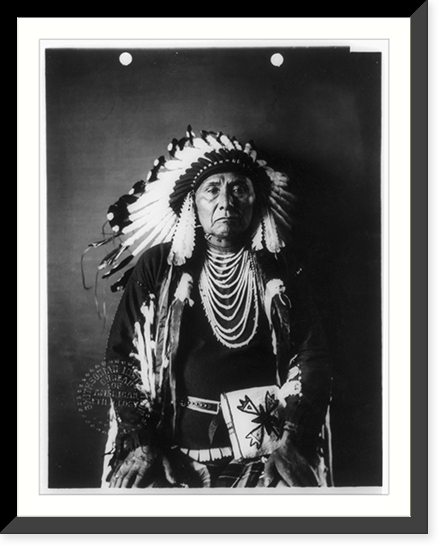 Chief Joseph, ca. 1840-1904 half-length portrait, seated, facing front, Historic Print