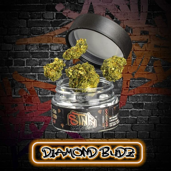 Experience the invigorating effects of STNR Creations Diamond Budz 3.5g in the iconic Sour Diesel strain, captured in this vivid image showcasing the premium quality hemp flower. Each bud is expertly infused with a potent blend of Delta 8, Delta 10 THC, and THCP, emanating a distinctive sour and gassy aroma that Sour Diesel is celebrated for. Notice the rich green hue and the dense trichome coverage that promises a euphoric and energizing experience. Perfect for connoisseurs seeking top-tier, USA-grown hemp with unparalleled flavor profiles. Discover the epitome of premium Delta 8 hemp flowers with STNR Creations, your prime source for artisan cannabinoid products.