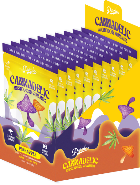 A vibrant and colorful image showcasing the Purple Cannadelic Microdose Gummies product. In the foreground, a sleek, resealable pouch stands upright on a reflective surface, displaying the product name and key ingredients (600mg THC and Magic Mushrooms) in bold, enticing fonts against a psychedelic purple background. The pouch is slightly open, revealing a peek of the gummies inside, which vary in shades of purple, yellow, and red, resembling the flavors pineapple, raspberry, and white gummy. Soft, glowing light enhances the pouch's vibrant colors, and in the background, a blurred array of tropical fruits (pineapples and raspberries) and mushroom silhouettes hint at the natural origins and flavors of the gummies.