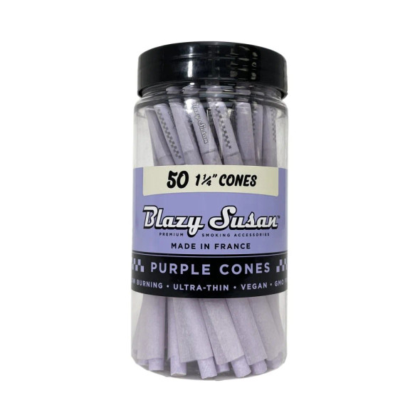 Close-up of Blazy Susan Purple Cones 1 1/4 (1.25) 50CT Jar, showcasing the vibrant purple pre-rolled cones neatly arranged inside the jar. The image emphasizes the premium quality, smooth burn, and stylish appearance of these cones, highlighting their convenience and unique color, perfect for enhancing any smoking session.