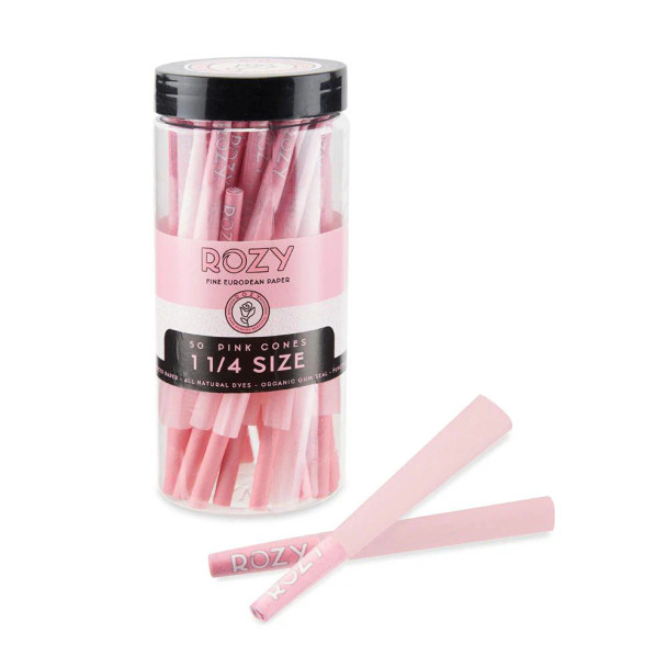 A bulk tub of Rozy Pink 1 ¼ Size Pre-Rolled Cones containing 50 cones, each pre-rolled with filter tips. The image showcases the bright pink packaging with the distinctive rose logo, designed to capture attention and stand out on any shelf. Ideal for smokers looking for a stylish, high-quality, and charitable smoking accessory.