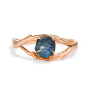 Rose gold engagement ring with large uncut teal blue sapphire by Olivia Ewing Jewelry