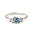 14K white gold three stone engagement ring with white and blue gemstones by Olivia Ewing Jewelry