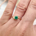 Emerald solitaire twig engagement ring by Olivia Ewing Jewelry