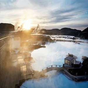 Steam rising from the milky blue geothermal water of the Blue Lagoon, Iceland