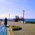 Cyclist on the seafront promenade at dusk on the Puglia coastal cycleway, Italy