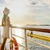 Traveller at the rail of a Nile cruise boat at sunrise, Egypt