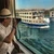 Photographer on deck as a Nile cruise boat passes, Egypt