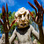 Asaro Mudman wearing a traditional clay mask and long bamboo finger claws, Eastern Highlands, Papua New Guinea