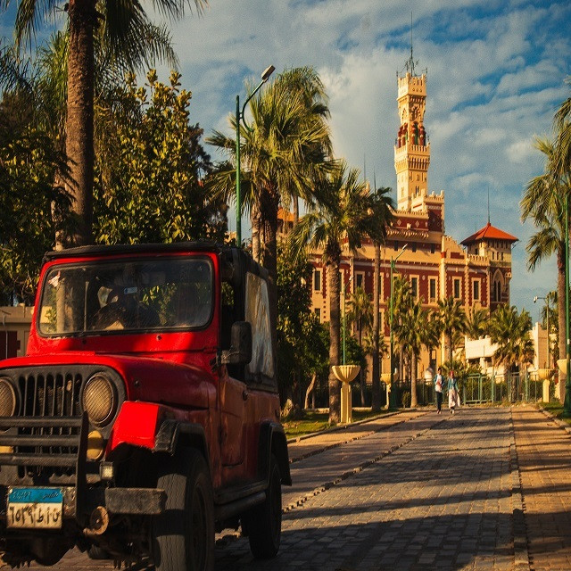 Vintage red bus outside Montazah Palace, Alexandria, Egypt