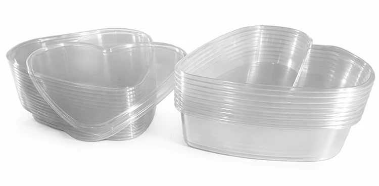 Clear thermoformed heart shaped tray container and lids stack for economical shipping and storage
