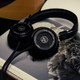 Grado SR60x Prestige Headphones — lifestyle on book