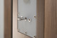 Q Acoustics Concept 500 bi-wire terminal panel close-up — rear connection detail with Light Oak side panels