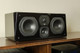 SVS Prime Centre Speaker Piano Gloss Black - lifestyle on AV shelf