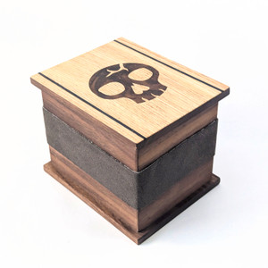 Walnut deck box for collectible card games. Marquetry lid featuring death/swamp/black design. Walnut deck box for collectible card games. Marquetry lid featuring death/swamp/black design.