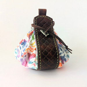 Leather and fabric dice pouch with a rainbow dragon design on a white background Leather and fabric dice pouch with a rainbow dragon design on a white background