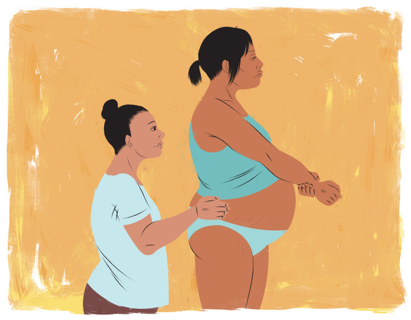 Doula and mother in labor