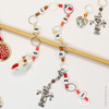 Chicken and scarecrow row counter with colourful beads for an eye catching row counter chain. Displayed over a bamboo knitting needle.