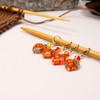 This set includes a mix of beaded stitch markers featuring vibrant orange millefiori flowers and adorable hearts.