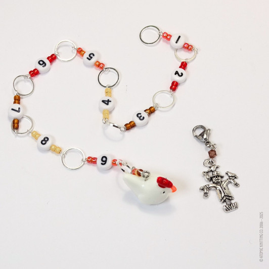 Chicken and scarecrow row counter with colourful beads for an eye catching row counter chain. Displayed on a white background.