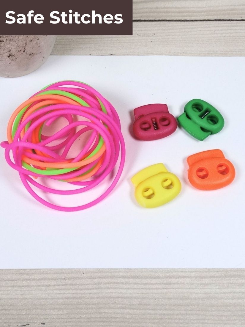 Knitting cords with a tin and two stitch locks