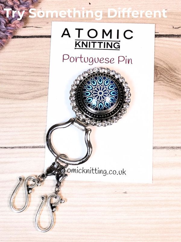 A magnetic portuguese knitting pin with double hooks on a backing card