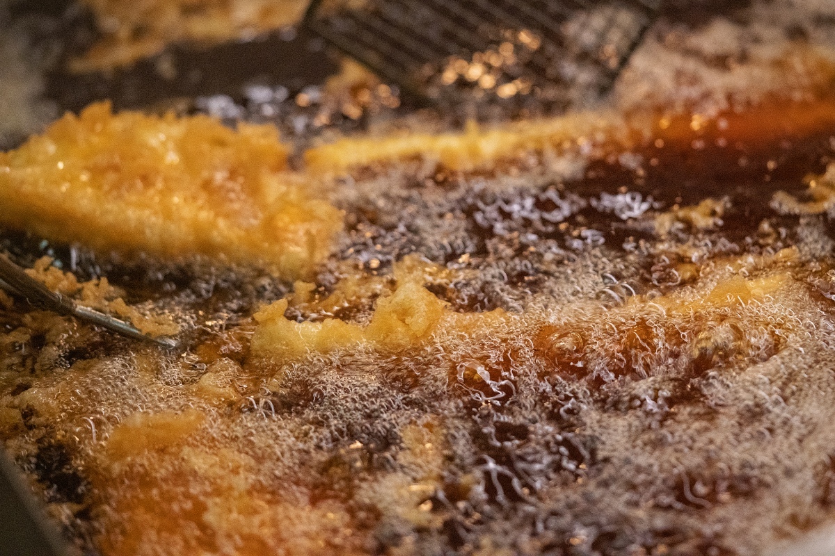 Fish frying in a busy service