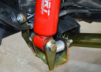 MetalCloak 7624 Outboard Shock Mount Spacer Relocation Kit Front Lower for Jeep Wrangler JL & Gladiator JT 2018+